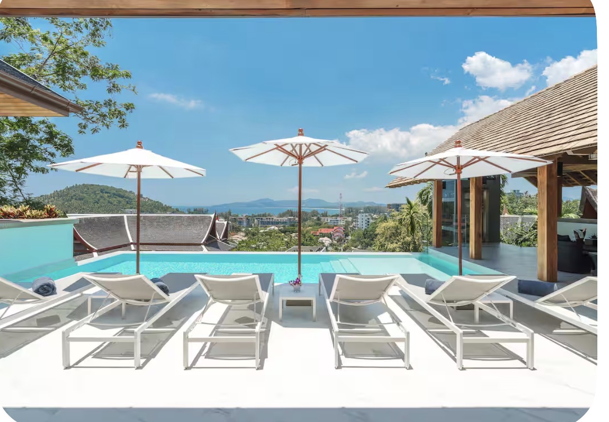 Poolside loungers and parasols with Andaman Sea views